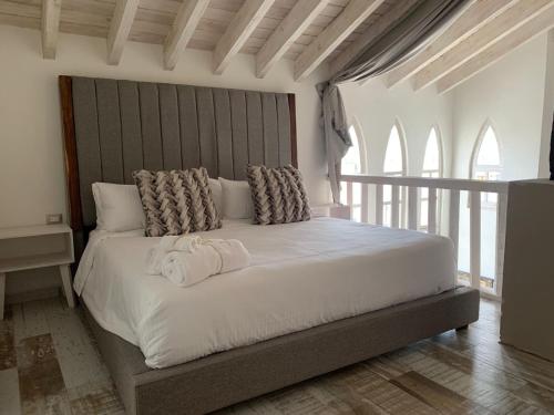 Ліжко або ліжка в номері Casa Martha hotel boutique