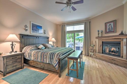 a bedroom with a bed and a fireplace at Modern Dalton Ranch Golf Club Home with Mtn View in Hermosa