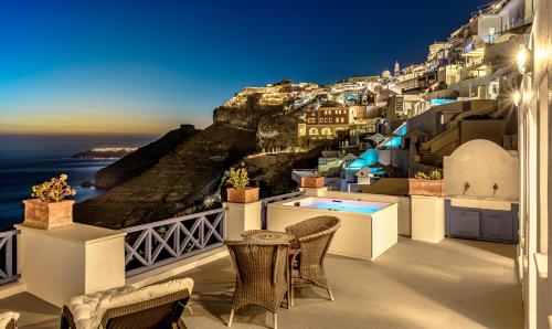 a balcony with a view of the amalfi coast at Golden Grey Goose in Fira