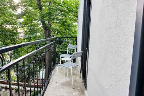 a pair of chairs sitting on a balcony at Florina Hotel in Istanbul