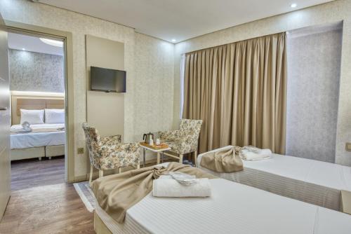 Кровать или кровати в номере Florina Hotel