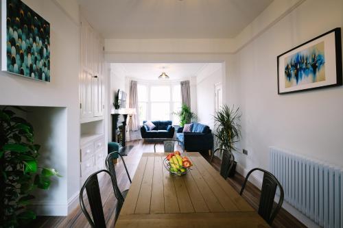 a living room with a table and chairs at Period Retreat for 6, explore the Lake District in Lancaster