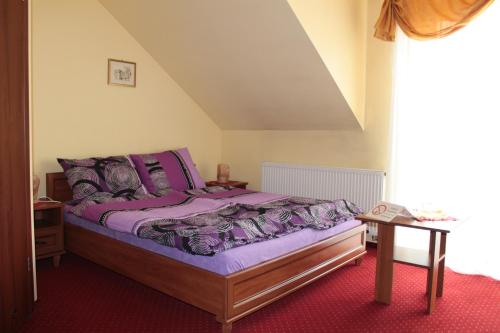 Postel nebo postele na pokoji v ubytování Zajazd Skorpion B&B