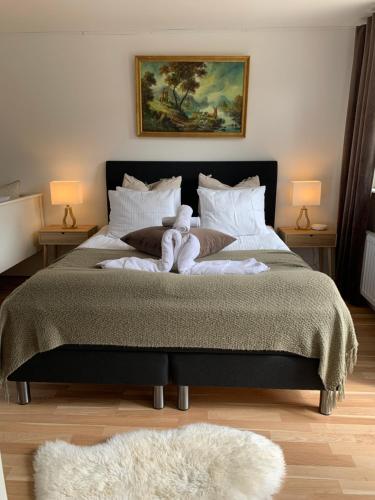 a bedroom with a large bed with towels on it at Stugor - Lgh sodra Oland in Mörbylånga