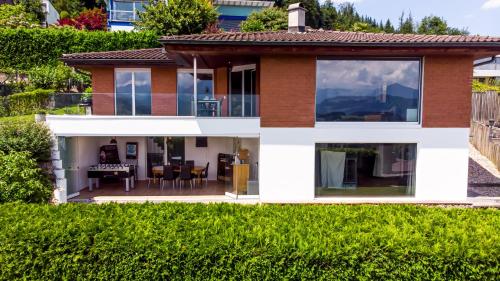a house with a view of a garden at Young Backpackers Homestay in Luzern