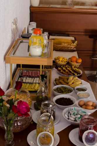 a table with many plates of food on it at Hotel El Greco in Sitia
