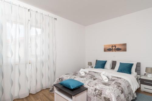 Postel nebo postele na pokoji v ubytování Apartman Palada
