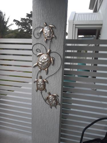 a metal pole with some crab hooks on it at SeaTurtle in Clifton Beach