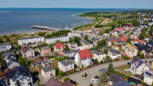 an aerial view of a small town by the water at Szyper in Jastarnia