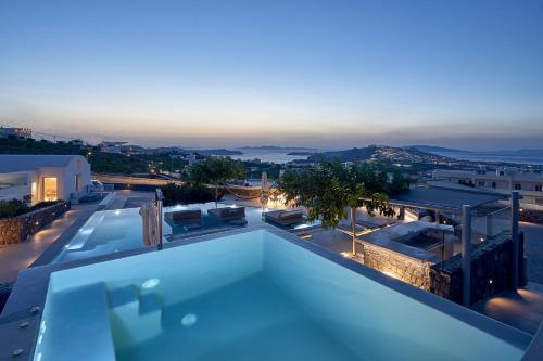 a swimming pool on the roof of a house at Nova Luxury Suites in Pirgos