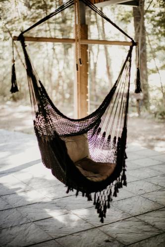 a hammock hanging from a gazebo at Glamping The Teepee in Mombeltrán
