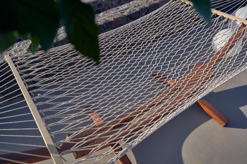 a net on a boat with birds on it at Nova Luxury Suites in Pirgos
