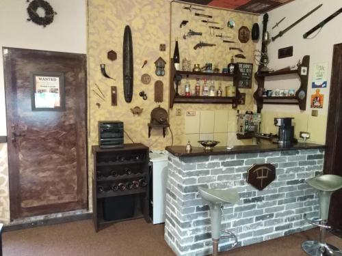 a kitchen with a stove and a brick wall at Villa Sunshine / Slunečna Vila in Krásná Lípa