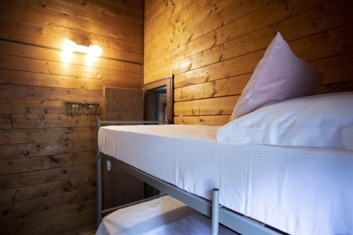 A bed or beds in a room at IseoLakeRental - Villa Alessandra