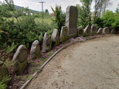 a grave yard with a line of stone monuments at Villa Sunshine / Slunečna Vila in Krásná Lípa