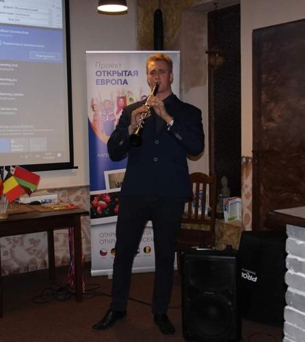 a man playing a clarinet in front of a screen at Villa Sunshine / Slunečna Vila in Krásná Lípa