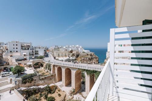a view of a city from a balcony of a building at Lamare cucina e dimore in Polignano a Mare
