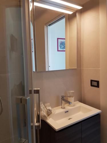 a bathroom with a sink and a mirror at Villa Glamour in Taormina