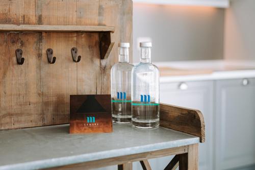 two bottles sitting on top of a table at Lamare cucina e dimore in Polignano a Mare