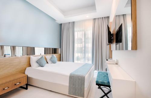 Postel nebo postele na pokoji v ubytování Dosinia Luxury Resort-Ultra All Inclusive