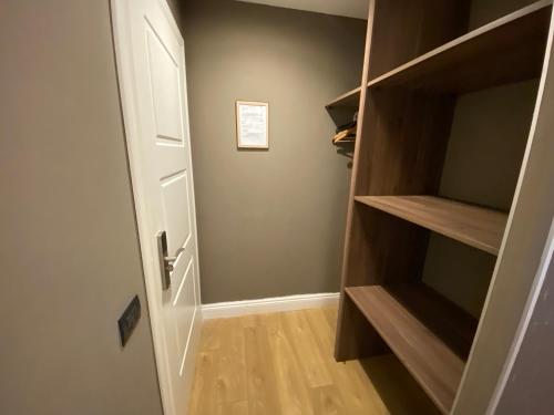 a hallway with an open door to a closet at 7th Floor Suite in Naples
