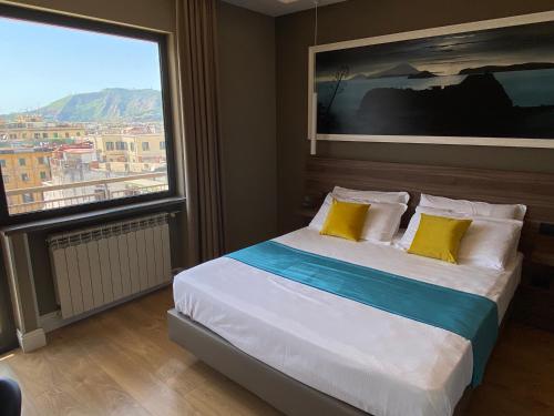 a bedroom with a bed with a large window at 7th Floor Suite in Naples