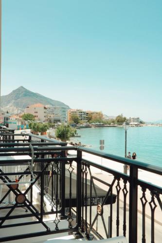 a balcony with a view of a body of water at Hotel Kyani Akti in Xylokastron
