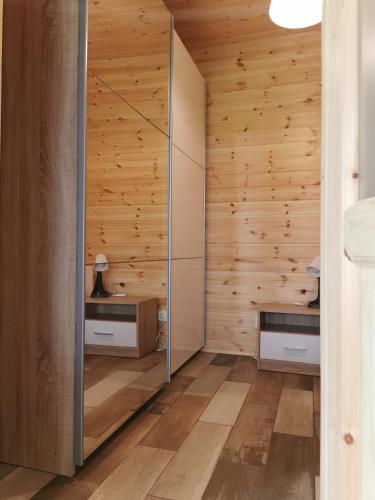 a room with wooden walls and wooden flooring at Relax in Stegna