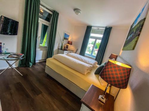 En eller flere senge i et værelse på Trompeterschlössle Hotel & Residence