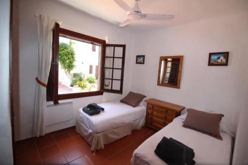 Posteľ alebo postele v izbe v ubytovaní Casa Cristalina Menorca
