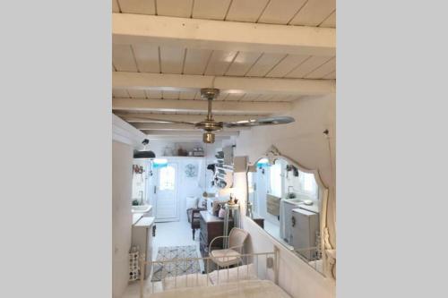 a view of a living room and kitchen of a caravan at little cactus in Serifos Chora