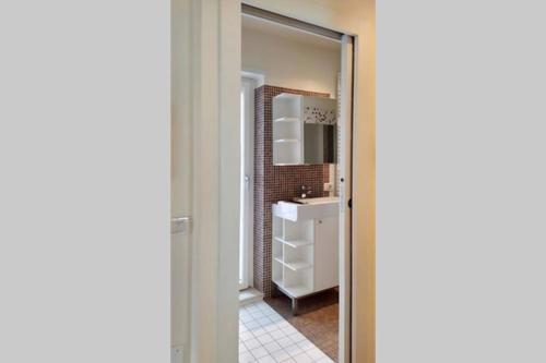 a bathroom with a mirror and a sink at CASA CHECHE - Nel cuore di Fiera di Primiero in Fiera di Primiero