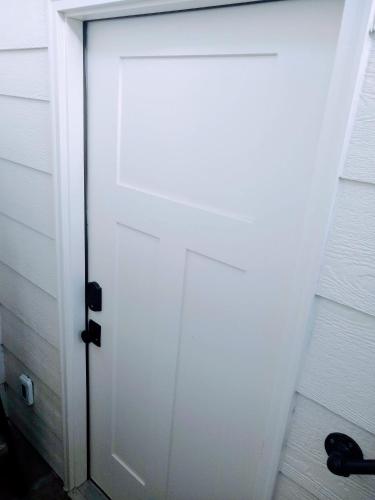 a white door with a black handle in a room at Sevier River Farmhouse 3 in Hatch