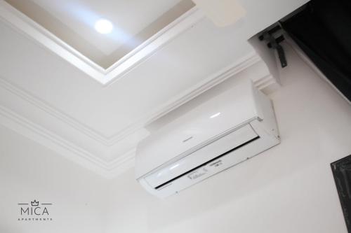 a coffered ceiling in a room with a white ceiling at Mica Apartments in Sere Kunda
