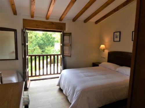 מיטה או מיטות בחדר ב-Palación de Toñanes