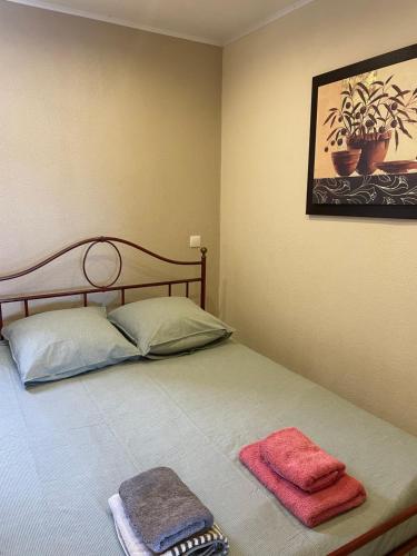 מיטה או מיטות בחדר ב-Mas des Grives