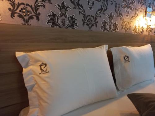 Cama o camas de una habitación en Hotel Petaluma Piumhi