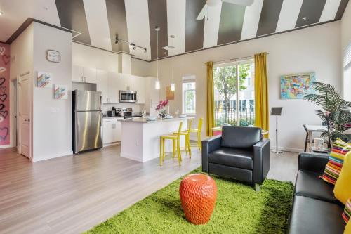 a kitchen and living room with a couch and chairs at Lux House Of Champagne 2BR 2BA Free Parking & Wifi in Baltimore