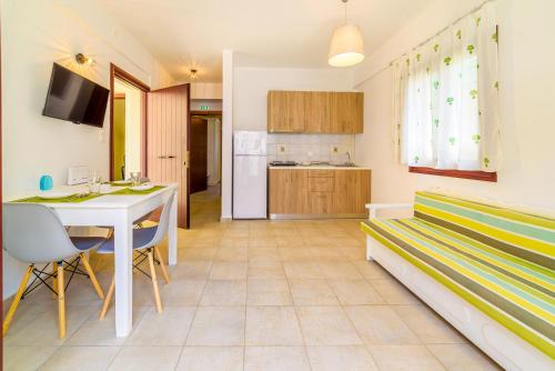 a living room with a couch and a table at Harmony House in Platanias