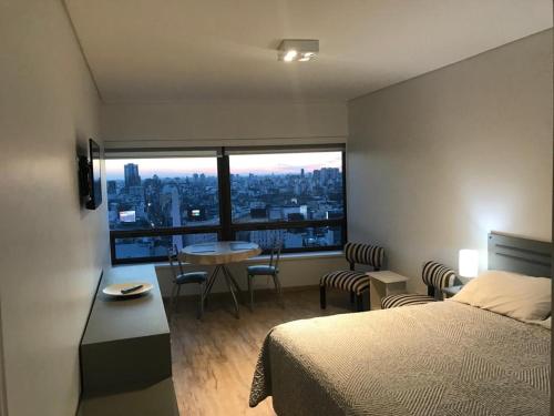 Ένα ή περισσότερα κρεβάτια σε δωμάτιο στο Buenos Aires Apart