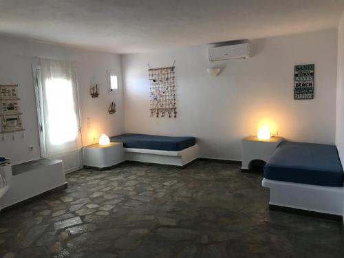 Ένα ή περισσότερα κρεβάτια σε δωμάτιο στο The Aegean Horizon Villa