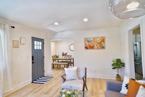 a living room with a couch and a chair at @ Marbella Lane - Vibrant 4BR RWC Ldry + P in Redwood City