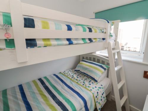 En eller flere senge i et værelse på The Nest