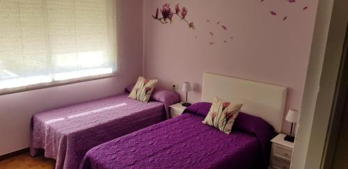 Ένα ή περισσότερα κρεβάτια σε δωμάτιο στο 3 bedrooms apartement at A Guarda 800 m away from the beach with sea view enclosed garden and wifi
