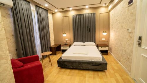 Postel nebo postele na pokoji v ubytování DYMAR HOTEL