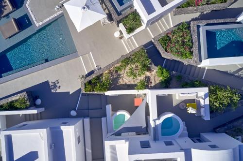 an overhead view of a house with a pool at Nova Luxury Suites in Pirgos