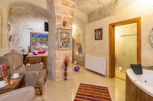 a living room with chairs and a table in a building at Lord of Cappadocia Hotel in Goreme