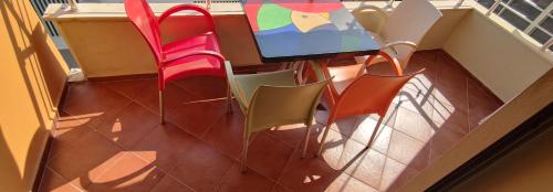 an overhead view of a table and chairs on a balcony at Wonderful Sea View Apartment Qerret in Golem