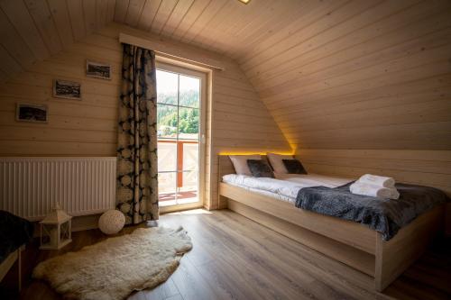 Кровать или кровати в номере Beskidzki Domek