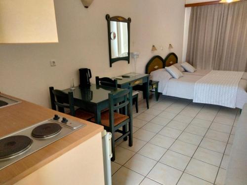 A bed or beds in a room at Zannis Hotel